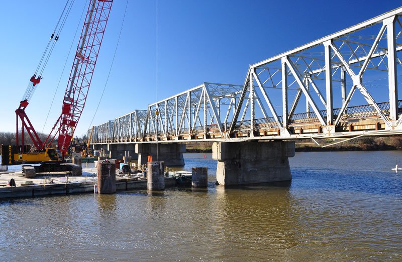 Crane on a barge in the Grand River during bridge repairs.